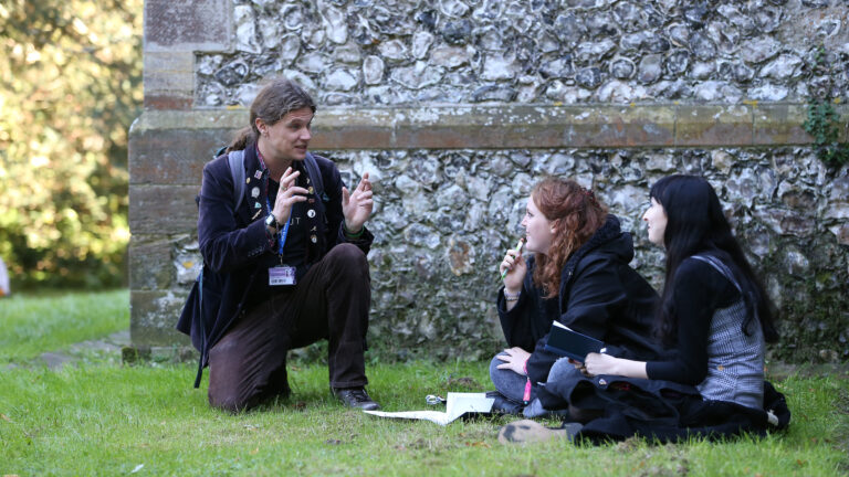 University of Brighton lecturer Craig Jordan Baker with Creative Writing and Media Students at Stanmer Church. 24 Sep 2018