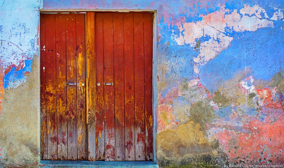 old door with brightly coloured wall